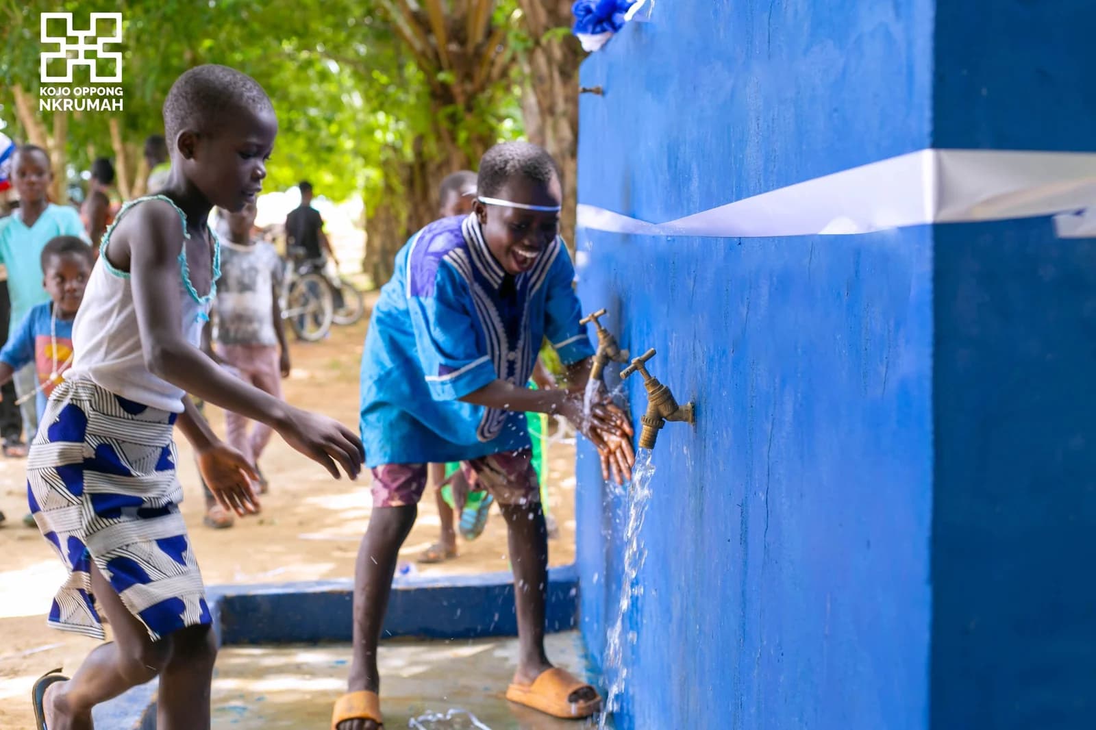 Children washing their hands at the taps of a newly commissioned community water facility in Ofoase-Ayirebi.